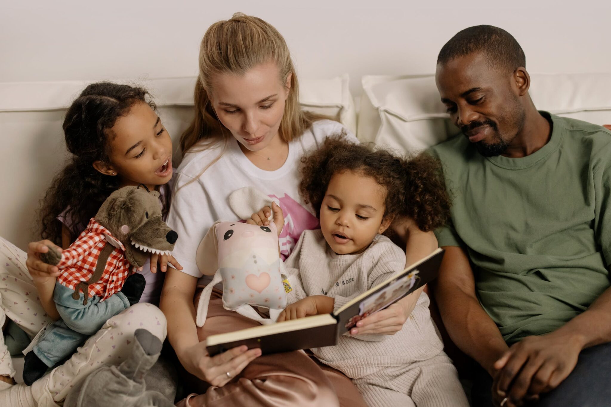 a family is enjoying reading a picture book together. Critical thinking storytelling