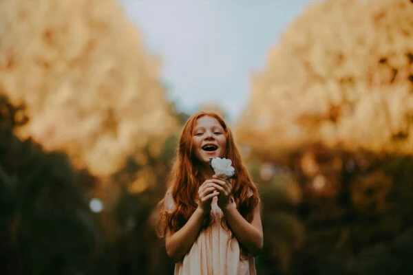 Soul education presented by a girl holding a flower
